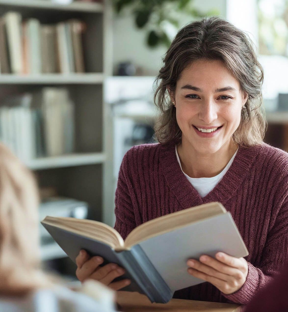 smiling-women-with-book.jpg